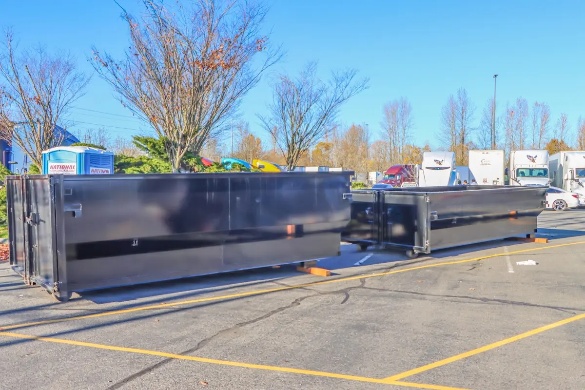 Professional dumpster rental service with roll-off container on residential driveway in Chino